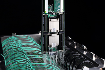 A server being taken out of the cooling fluid